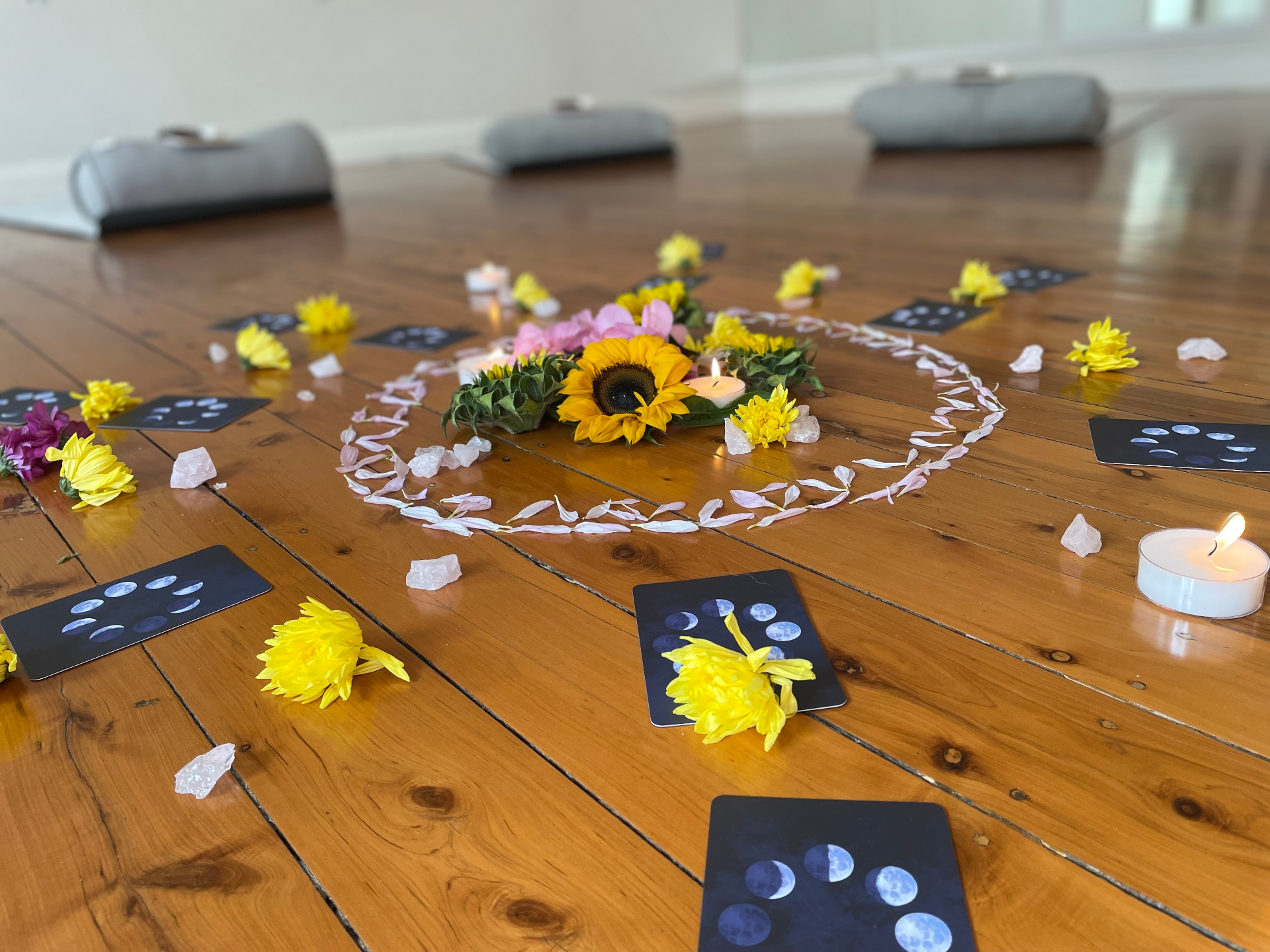 Sacred ceremony circle with flowers and moon cards